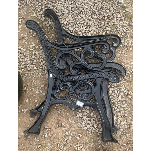 394 - Pair of cast-iron bench ends