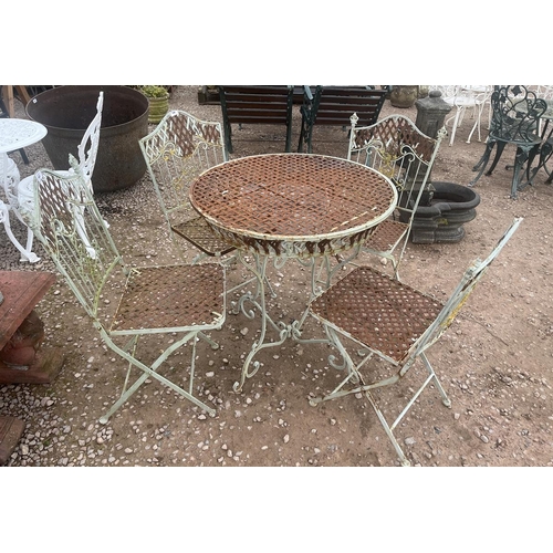 440 - Circular metal garden table with 4 chairs