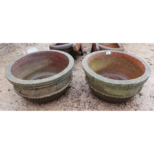 495 - Pair of circular stone planters