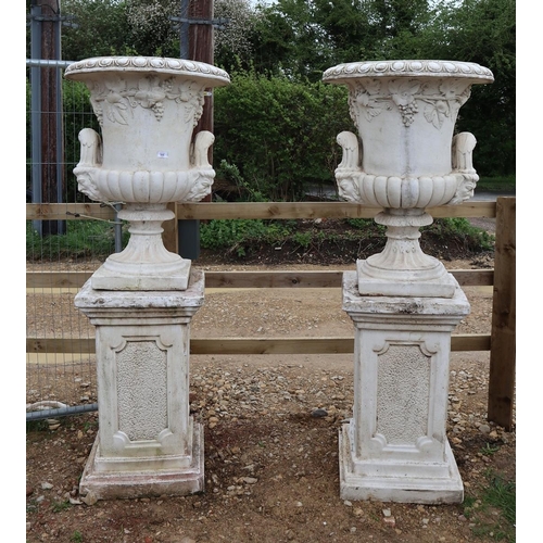 555 - Large and impressive pair of pedestal recon stone handled planters on plinths in white - Approx heig...
