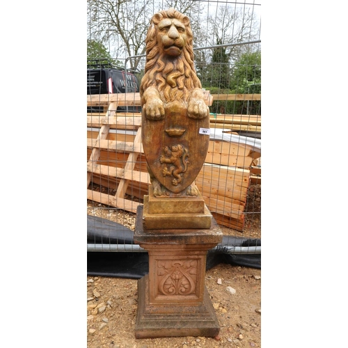 561 - Sitting stone lion with crest on plinth - Approx height: 130cm