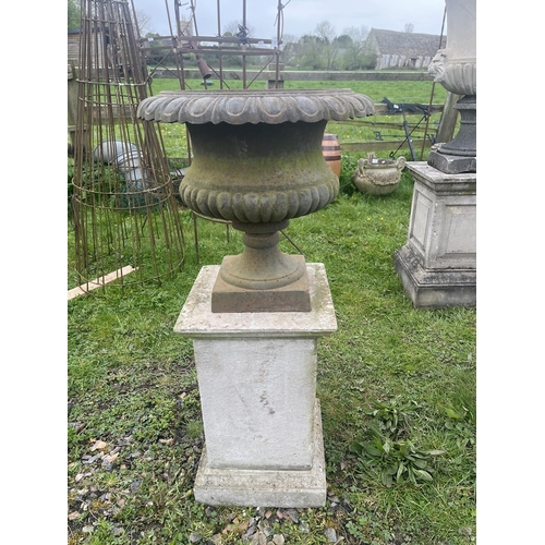 114 - Set of 3 cast iron pedestal planters on stone plinths