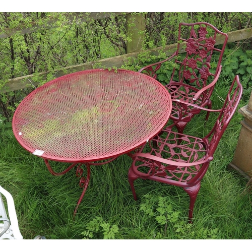 192 - Circular metal garden table together with 2 chairs