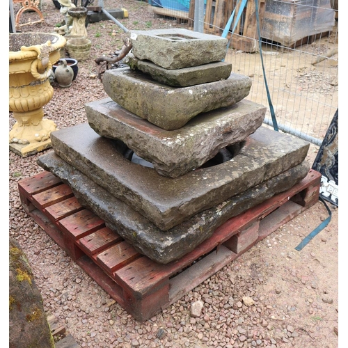 490 - Collection of stone well tops etc.