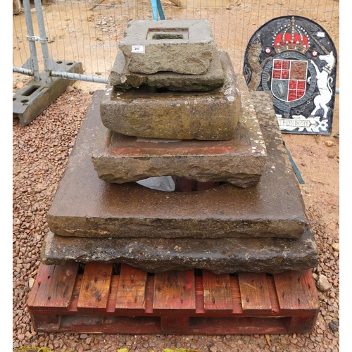 490 - Collection of stone well tops etc.