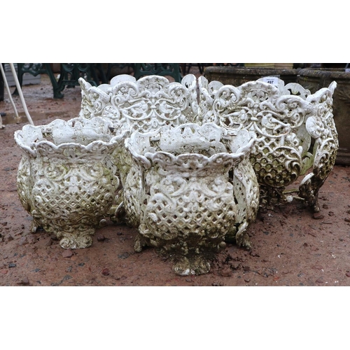 497 - 2 pairs of pierced metal pot stands