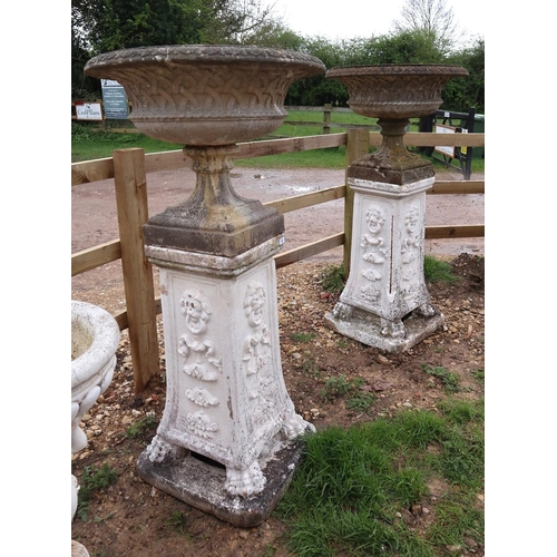 553 - Pair of large latticed urns on Gothic lion pawed plinths - Approx height: 153cm