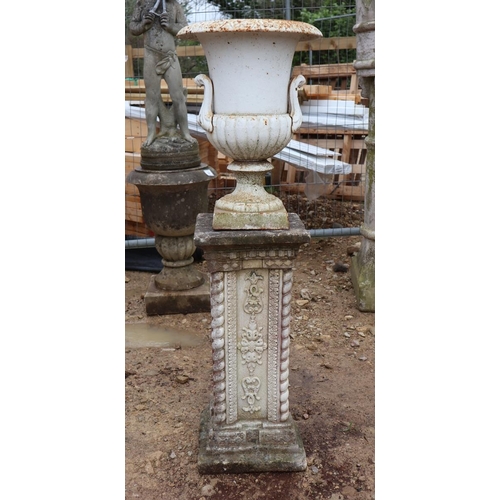 568 - Small pair of cast iron pedestal urns on stone bases