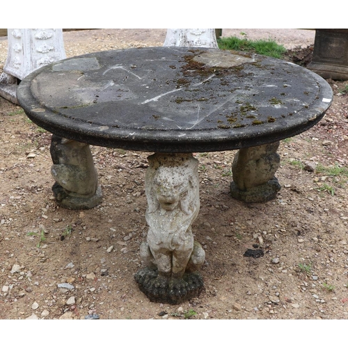 573 - Large stone circular lion themed garden table - Approx size: Diameter: 136cm H: 73cm