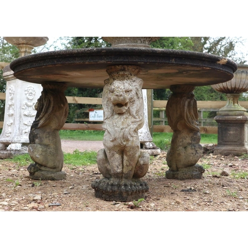 573 - Large stone circular lion themed garden table - Approx size: Diameter: 136cm H: 73cm