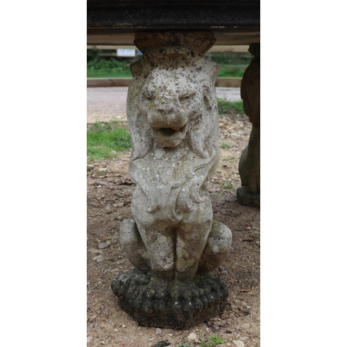 573 - Large stone circular lion themed garden table - Approx size: Diameter: 136cm H: 73cm