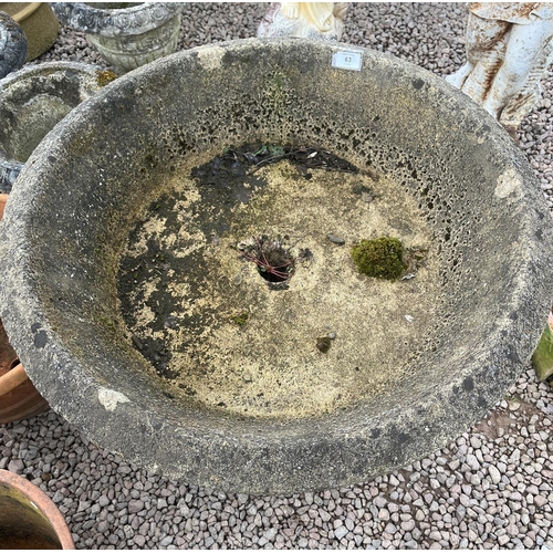 63 - Large round stone planter on limestone base