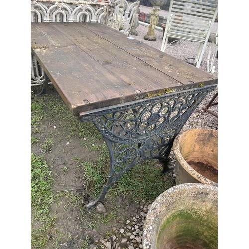 88 - Wooden table with cast iron ends