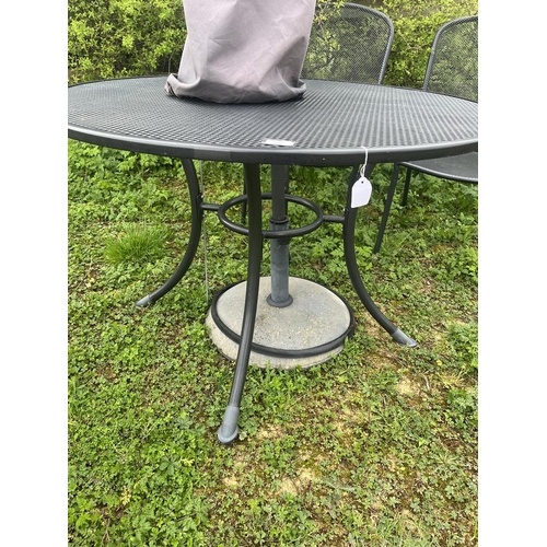 97 - Mesh topped circular table and 2 chairs (with cushions) together with parasol