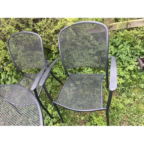 97 - Mesh topped circular table and 2 chairs (with cushions) together with parasol