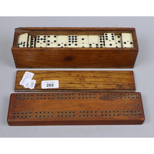 202 - Dominoes set together with cribbage board