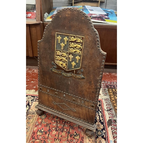 256 - Victorian leather covered fire screen with crest