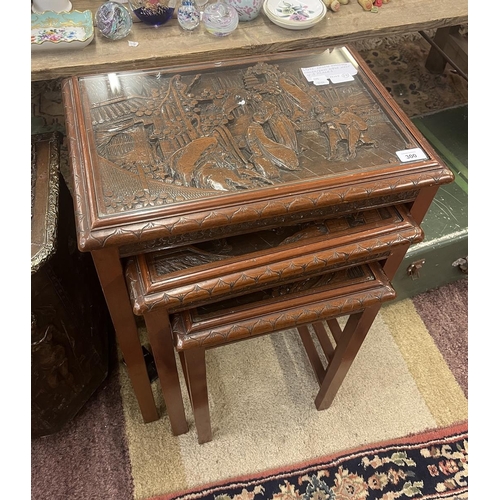 300 - Chinese hardwood carved glass topped nest of 3 tables