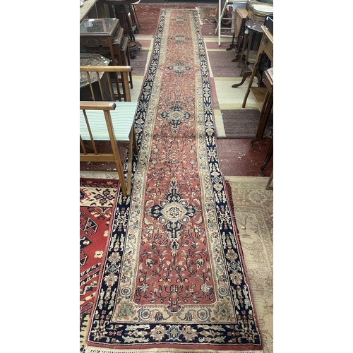 304 - Large red patterned runner - Approx size: 620cm x 78cm