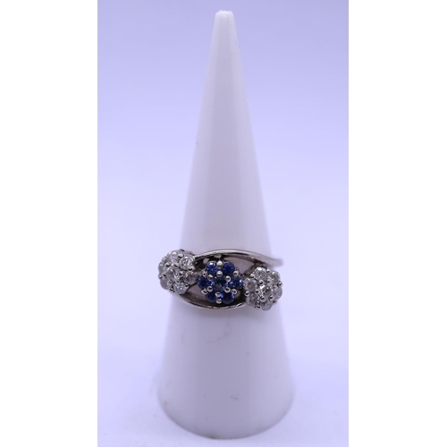 35 - 18ct white gold sapphire and diamond ring - Size N