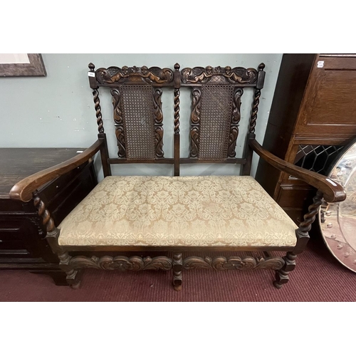 377 - Late 19th to early 20th century Jacobean style carved rail hall bench with bergère back