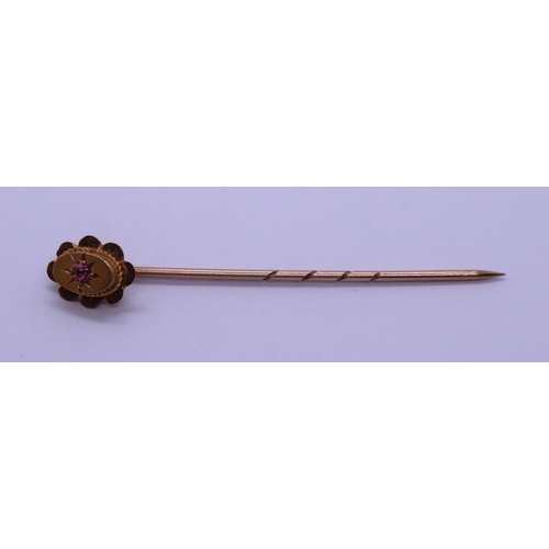 70 - Cased 9ct gold stick pin set with ruby