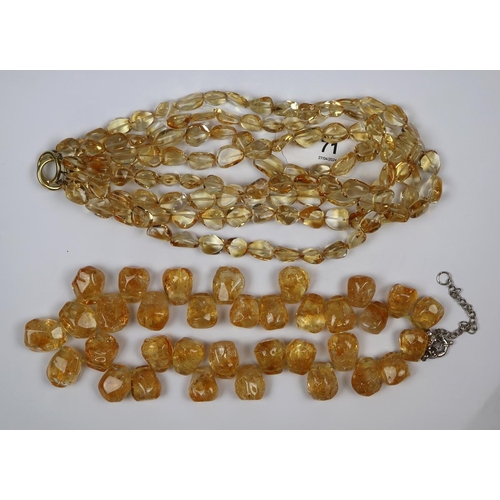 71 - 2 natural citrine necklaces one with a 18ct gold clasp & one with a silver clasp