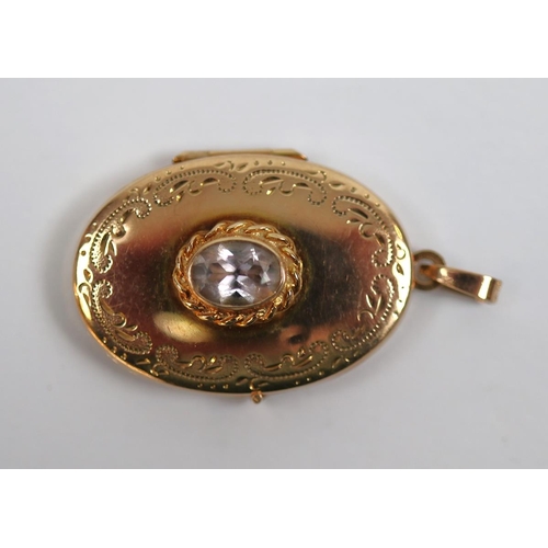 81 - 9ct gold stone set locket