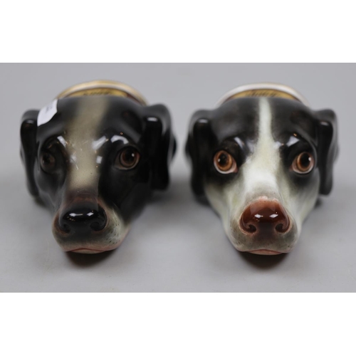 116 - Pair of ceramic stirrup cups in the form of dogs