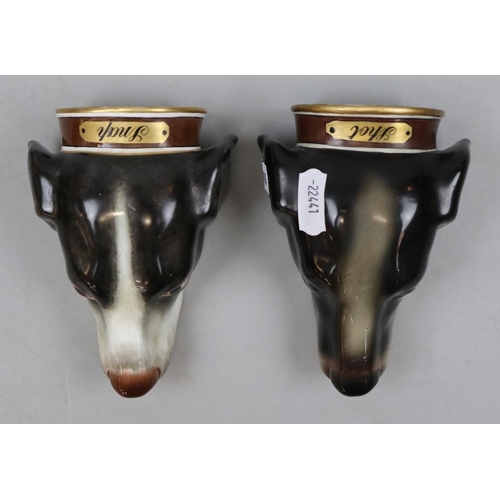 116 - Pair of ceramic stirrup cups in the form of dogs