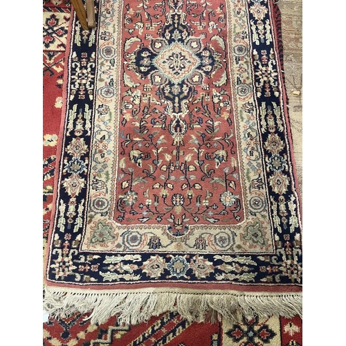 304 - Large red patterned runner - Approx size: 620cm x 78cm