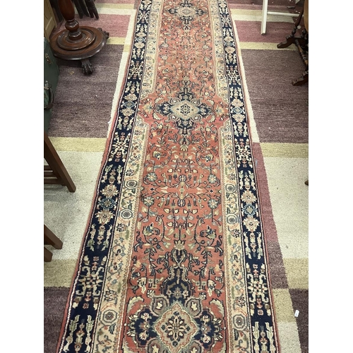 304 - Large red patterned runner - Approx size: 620cm x 78cm