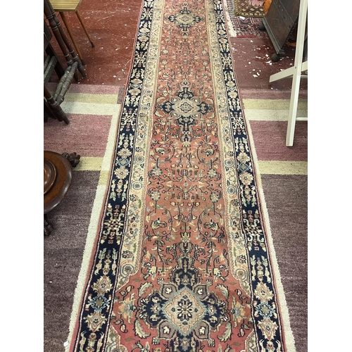 304 - Large red patterned runner - Approx size: 620cm x 78cm