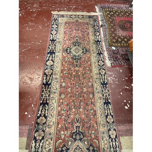 304 - Large red patterned runner - Approx size: 620cm x 78cm