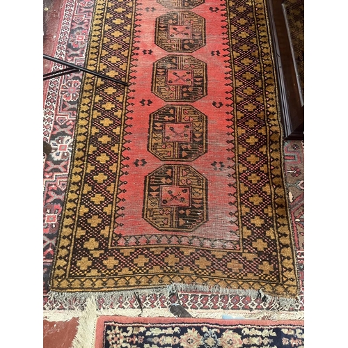 305 - Large red patterned runner - Approx size: 300cm x 89cm