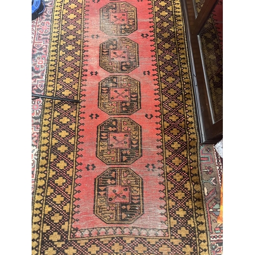 305 - Large red patterned runner - Approx size: 300cm x 89cm