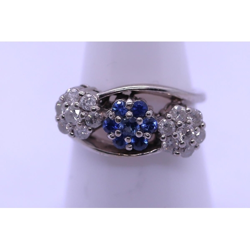 35 - 18ct white gold sapphire and diamond ring - Size N