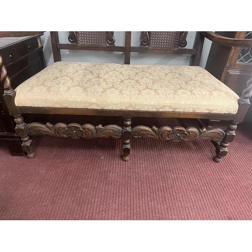 377 - Late 19th to early 20th century Jacobean style carved rail hall bench with bergère back