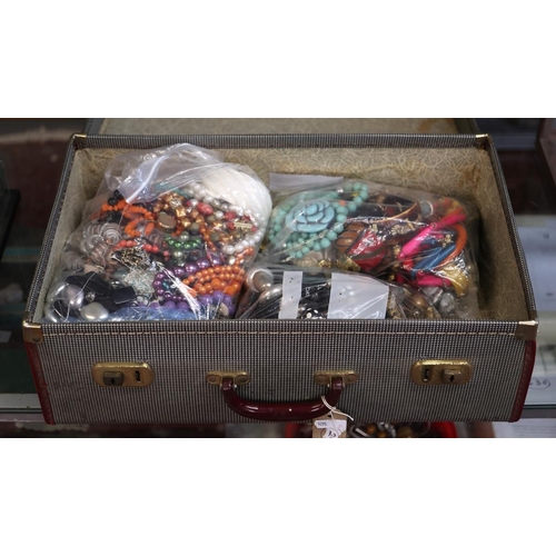 124 - Large collection of costume jewellery in suitcase