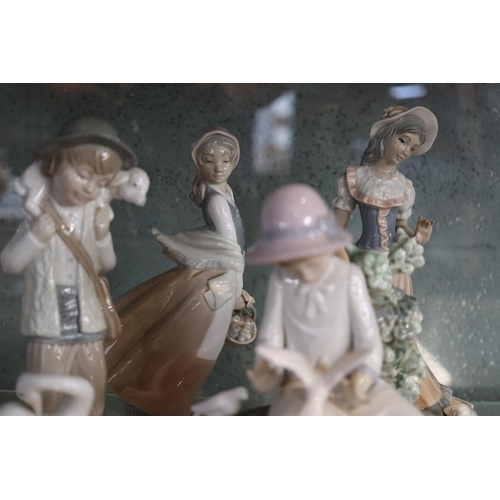 154 - Collection of figurines to include Nao, Lladro etc