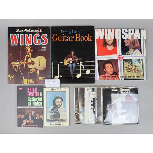 211 - Beatles memorabilia - collection of books together with 7'' singles