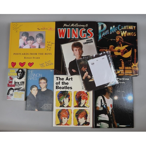 226 - Beatles memorabilia - collection of books together with a couple of 7'' singles