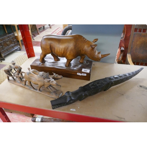 264 - 3 wooden carvings to include a rhinoceros