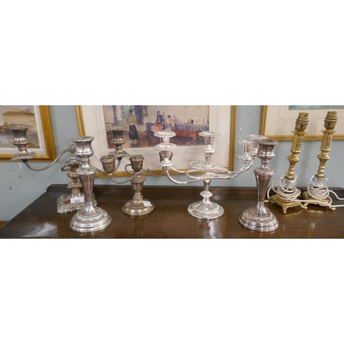 363 - 2 silverplate candelabras, 1 silver on copper candelabra, pair of candlesticks together with a pair ... 