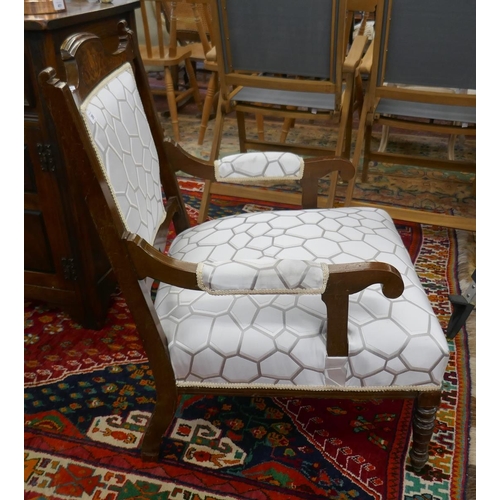 399 - Inlaid upholstered armchair on casters