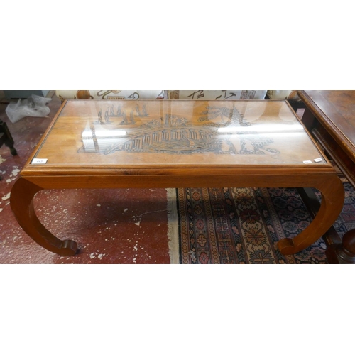 443 - Glass topped Oriental coffee table - Approx size: W: 109cm D: 45cm H: 46cm