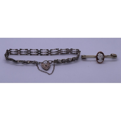 62 - Silver gate link bracelet together with a yellow metal cameo brooch