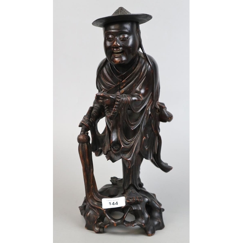 144 - Hand carved hardwood Oriental gentleman - Approx height 37cm