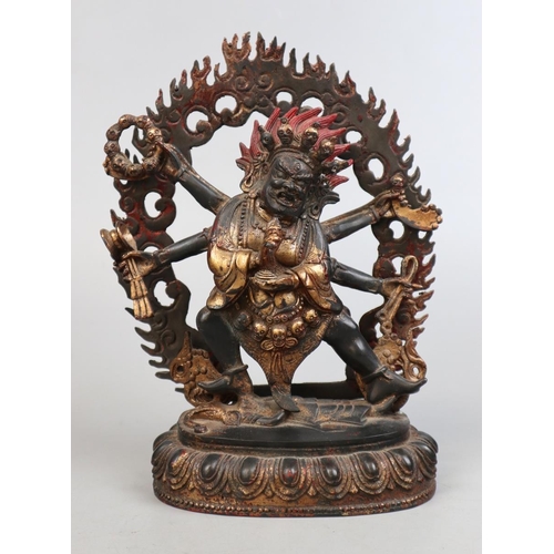 Antique Tibetan gilt bronze Deity holding skulls - Approx height 27cm
