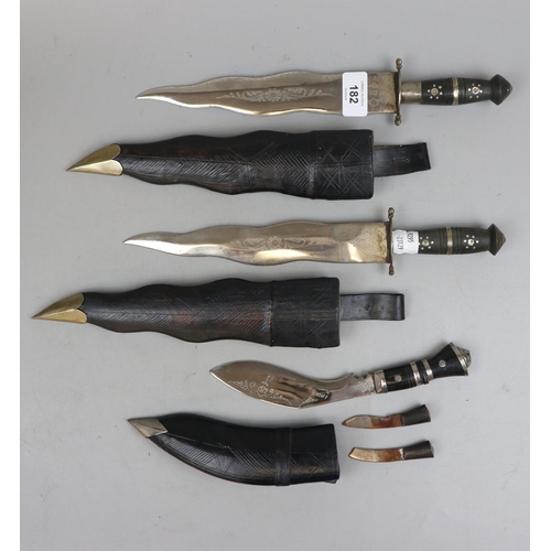182 - 2 x 'Kris' or 'Flame' bladed Kukhris, plus smaller version with accessory blades